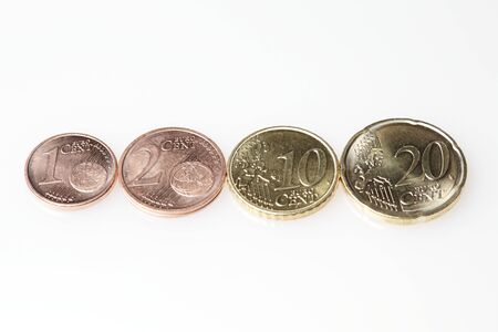 euro coins in row on white background