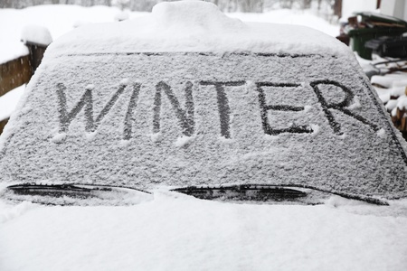 Winter with snow flakes on car screen の写真素材