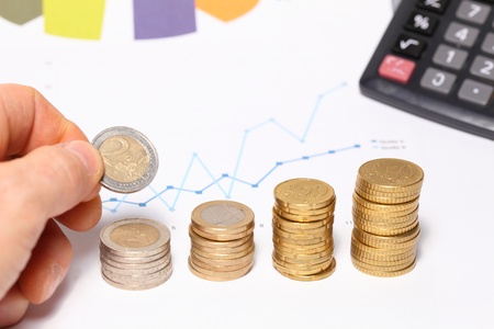 An illustration of coins forming upward chart 