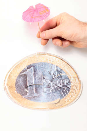 Financial crisis concept: save  euro coin with umbrella