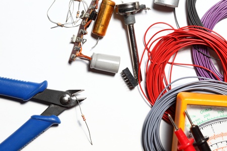 some colorful wire rolls with side cutter and electronicsの写真素材