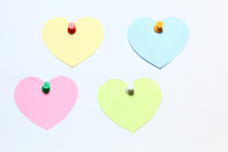 four stickers attached drawing pin with white backgroundの写真素材