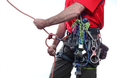 mountaineer with climbing equipment on white backgroundの写真素材