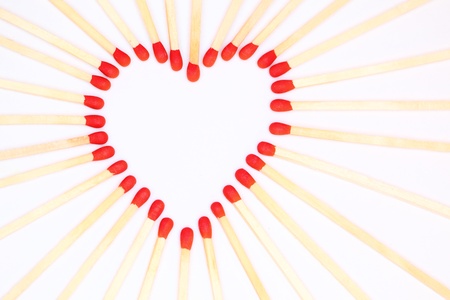 a heart with many red matches, symbol of love の写真素材