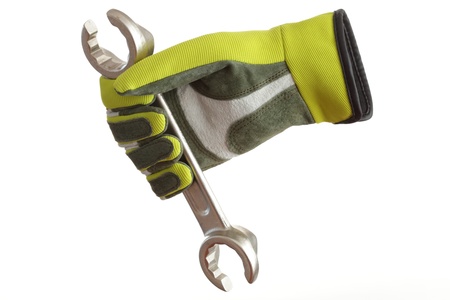 a colored glove with wrench in handの写真素材