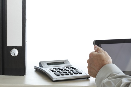 working data with tablet and documents on deskの写真素材