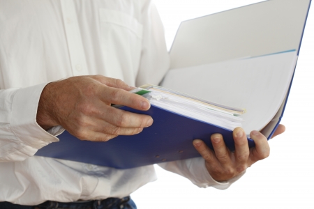 man with folder in hand is searchingの写真素材