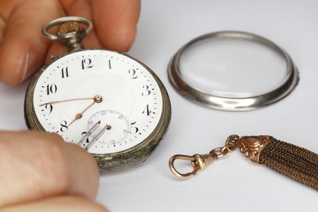 repairing old clock work, mechanical vintage watch