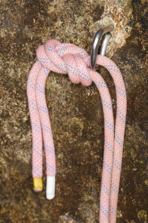 eight knot with hook and rock background