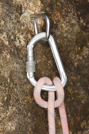 knot with carabiner on rock for safetyの写真素材