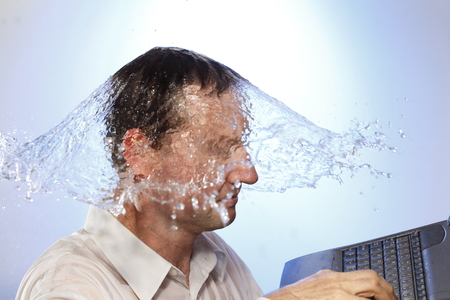 business man  with notebook and water splashの写真素材