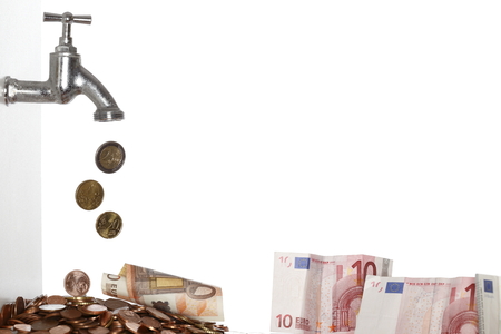 many raining coins and banknotes on white backgroundの写真素材