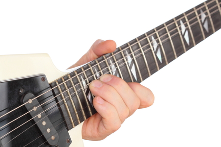 guitar player is playing with a white guitar