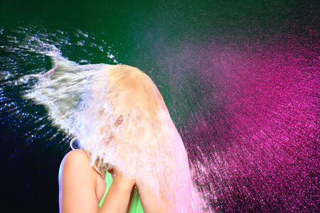 girl with swimwear got a colorful shower