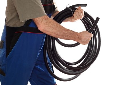 electrical worker with pipe in hand on white backgroundの写真素材