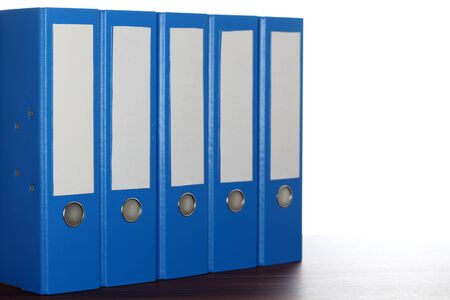 five blue file binders in a rowの写真素材