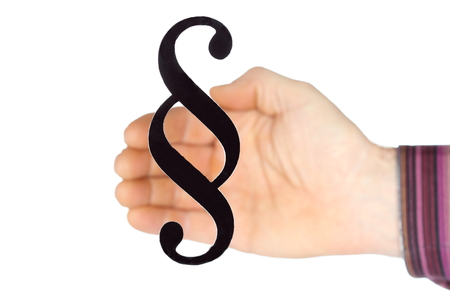 sign of a paragraph with hand in backgroundの写真素材