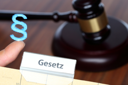 paragraph and register with law text on a desk