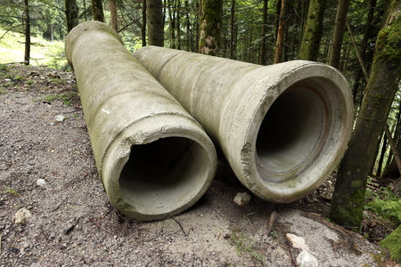 two big pipes for canalization on the groundの写真素材