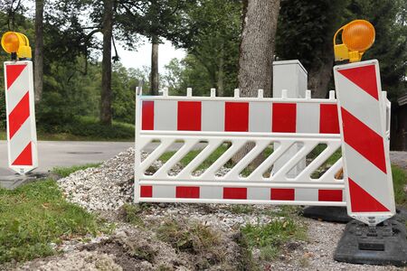 striped barricade on a street with distribution frame