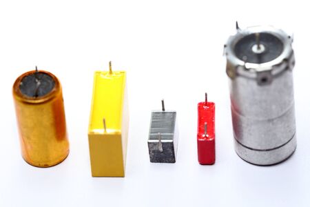 some different capacitors, old electronic devices for recyclingの写真素材