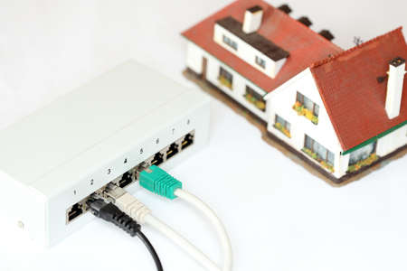 symbolic connection with cable, house and connection boxの写真素材