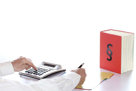 office worker is calculating the tax on desk