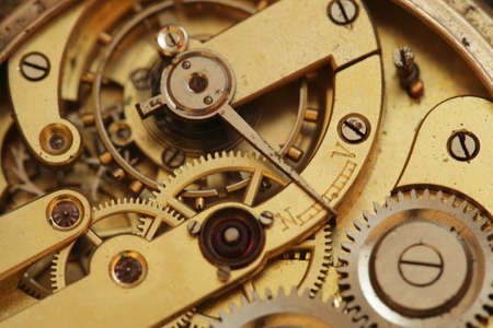 old clockwork inside view with gear wheelの写真素材