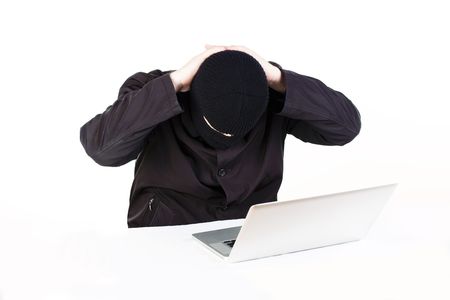 Man stealing data from a laptop