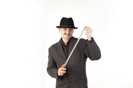 Man in hat with rulerの写真素材