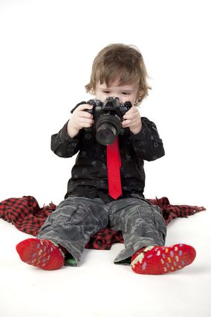 Cute child looking at photos and smilingの写真素材