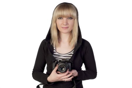Woman holding camera and looking straightの写真素材
