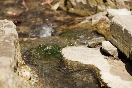 Stream in the middle of rocksの写真素材