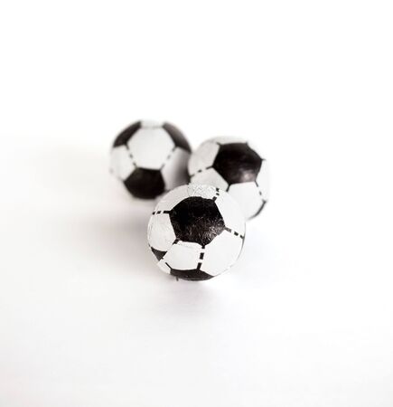 Three little footballs on a white backgroundの写真素材