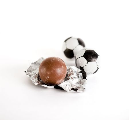 Little chocolate footballs on a white backgroundの写真素材
