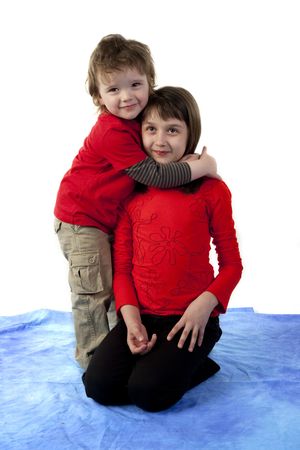 Cute boy hugging pretty girlの写真素材