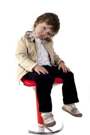 Child posing at camera on a white backgroundの写真素材