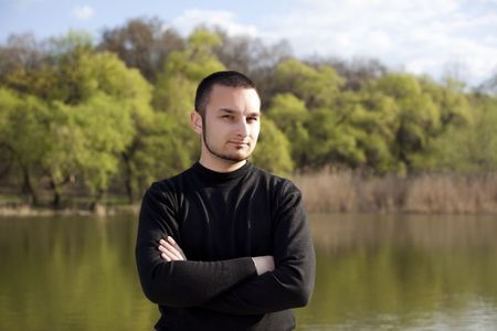 Cute adult posing at camera in a forestの写真素材