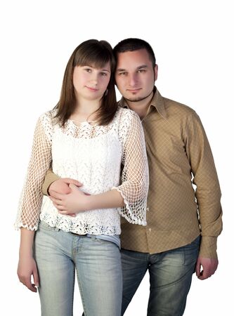 Young woman and young man hugging on a white backgroundの写真素材