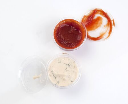 Ketchup and mayonnaise sauce on a white background の写真素材
