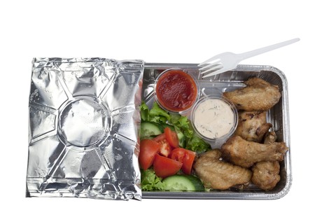 Vegetables,chicken wings, sauces in a package の写真素材