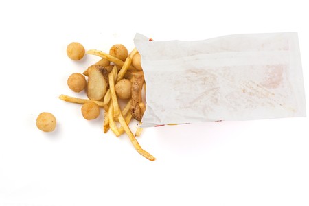 Package with different types of French fries on a white background  