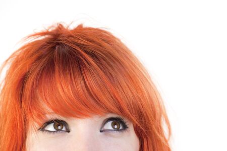 Beautiful eyes looking away on a white backgroundの写真素材