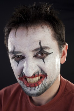 Clown looking at camera on a black backgroundの写真素材