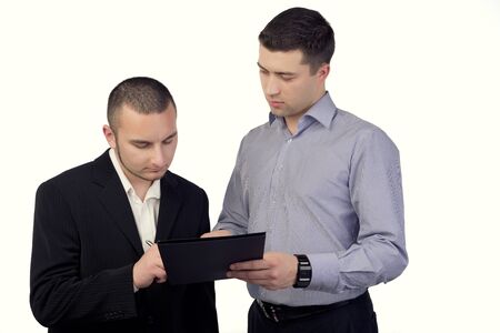 Two business people signing documentsの写真素材