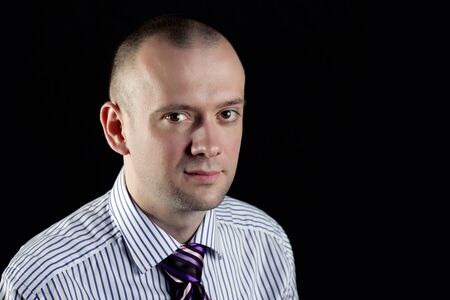 Portrait of businessman on a black background