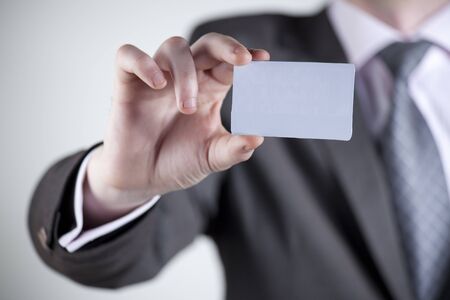 Hand of business man offering business cardの写真素材