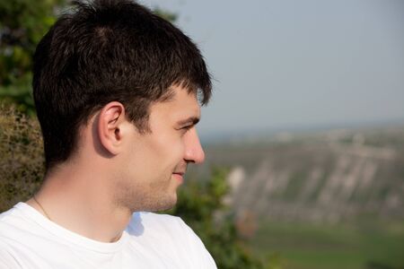 Portrait of young man looking awayの写真素材