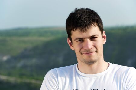 Portrait of young man looking at cameraの写真素材