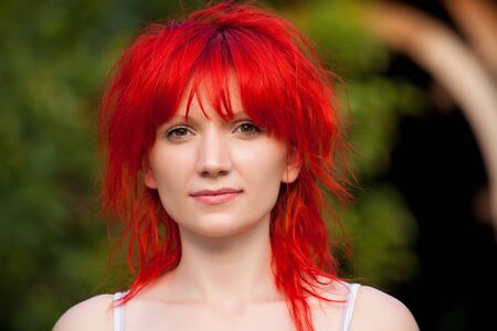 Portrait of redhead woman looking at cameraの写真素材
